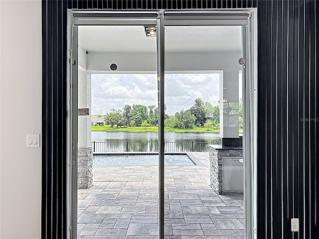 4993 Southlawn Ave, Orlando, FL 32811 - entryway with a water view, healthy amount of natural light, and stone finish floors