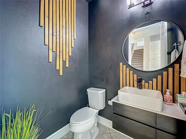 4993 Southlawn Ave, Orlando, FL 32811 - half bath with toilet, tile patterned flooring, vanity, and baseboards