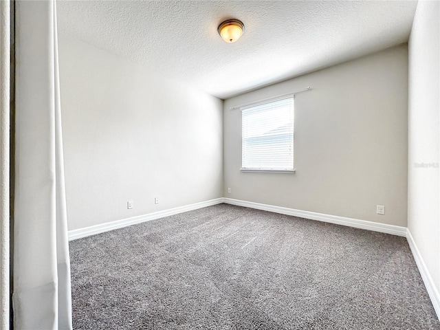 4993 Southlawn Ave, Orlando, FL 32811 - carpeted spare room with a textured ceiling and baseboards