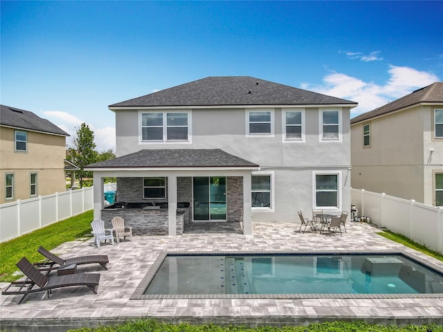 4993 Southlawn Ave, Orlando, FL 32811 - back of property with stucco siding, a fenced backyard, a patio area, and roof with shingles