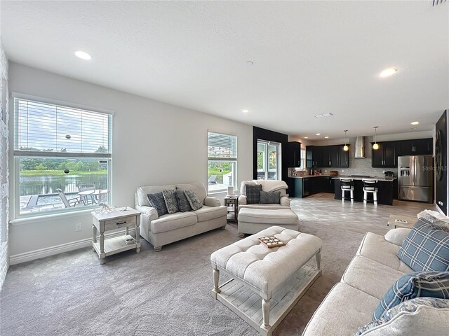 4993 Southlawn Ave, Orlando, FL 32811 - living room featuring recessed lighting and baseboards