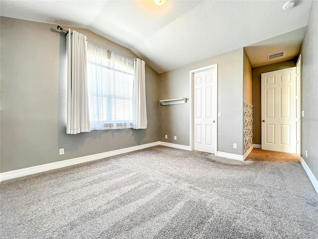4993 Southlawn Ave, Orlando, FL 32811 - unfurnished bedroom featuring vaulted ceiling, carpet flooring, and baseboards
