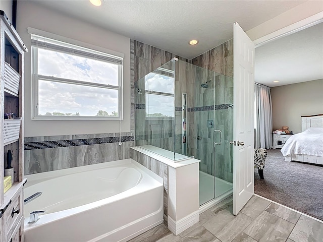 4993 Southlawn Ave, Orlando, FL 32811 - ensuite bathroom featuring a bath, a stall shower, recessed lighting, and a textured ceiling