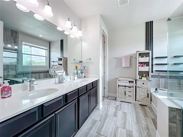 4993 Southlawn Ave, Orlando, FL 32811 - bathroom featuring a garden tub, double vanity, and a shower