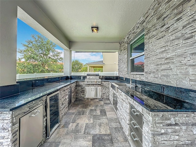 4993 Southlawn Ave, Orlando, FL 32811 - view of patio featuring wine cooler, a sink, and exterior kitchen