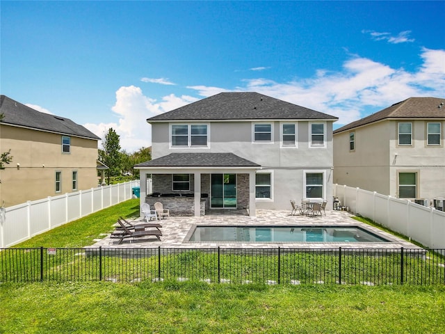 4993 Southlawn Ave, Orlando, FL 32811 - rear view of house with stucco siding, a patio area, a shingled roof, and stone siding