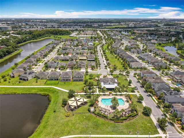 4993 Southlawn Ave, Orlando, FL 32811 - aerial perspective of suburban area featuring a large body of water and a pool area