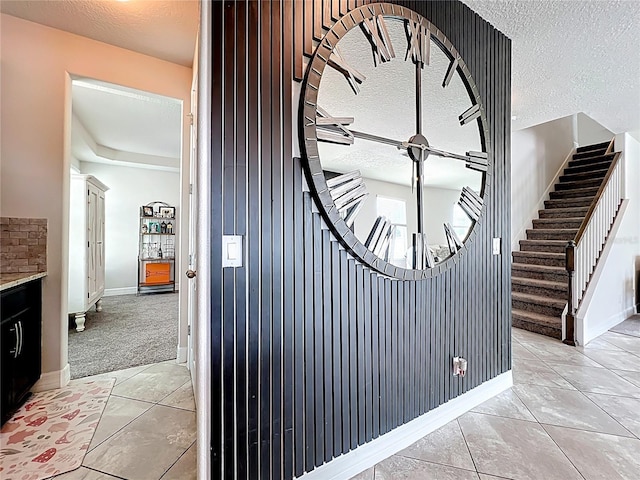 4993 Southlawn Ave, Orlando, FL 32811 - detailed view of baseboards, a textured ceiling, and carpet flooring