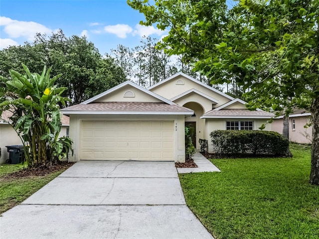 142 Stonegate Pass, Davenport, FL 33897 - single story home with stucco siding, concrete driveway, roof with shingles, and an attached garage