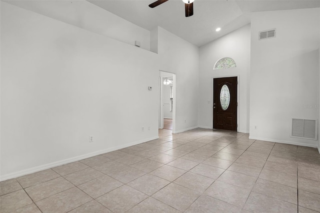 142 Stonegate Pass, Davenport, FL 33897 - foyer featuring ceiling fan, light tile patterned flooring, high vaulted ceiling, baseboards, and recessed lighting
