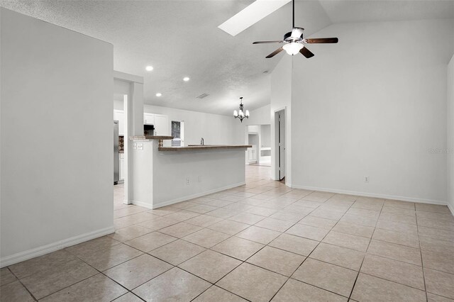 142 Stonegate Pass, Davenport, FL 33897 - unfurnished living room with light tile patterned floors, recessed lighting, a ceiling fan, a chandelier, and baseboards
