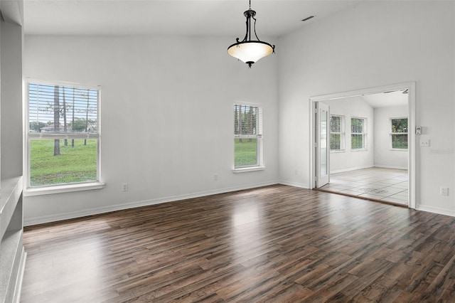 142 Stonegate Pass, Davenport, FL 33897 - empty room featuring wood finished floors and baseboards