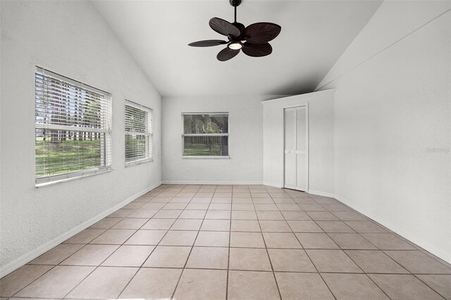 142 Stonegate Pass, Davenport, FL 33897 - spare room with ceiling fan, high vaulted ceiling, a textured wall, and baseboards