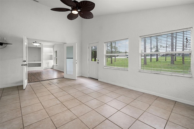 142 Stonegate Pass, Davenport, FL 33897 - empty room with a ceiling fan, light tile patterned floors, baseboards, a textured wall, and built in features