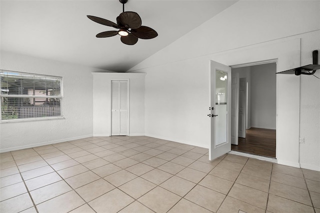 142 Stonegate Pass, Davenport, FL 33897 - empty room with ceiling fan, light tile patterned floors, a textured wall, and high vaulted ceiling