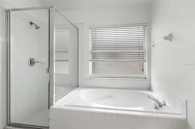 142 Stonegate Pass, Davenport, FL 33897 - bathroom with a shower stall and a bath