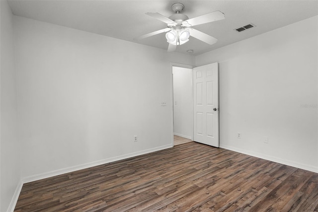 142 Stonegate Pass, Davenport, FL 33897 - unfurnished room with dark wood-type flooring, baseboards, and a ceiling fan