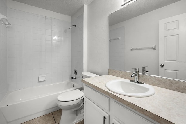 142 Stonegate Pass, Davenport, FL 33897 - full bathroom featuring toilet, vanity, a textured ceiling, washtub / shower combination, and tile patterned flooring
