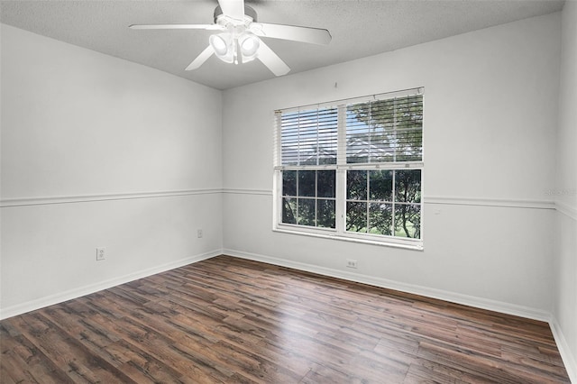 142 Stonegate Pass, Davenport, FL 33897 - unfurnished room with plenty of natural light, wood finished floors, baseboards, and a textured ceiling
