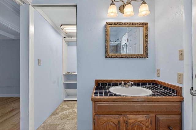 3637 Dubsdread Cir, Orlando, FL 32804 - bathroom with vanity and a chandelier
