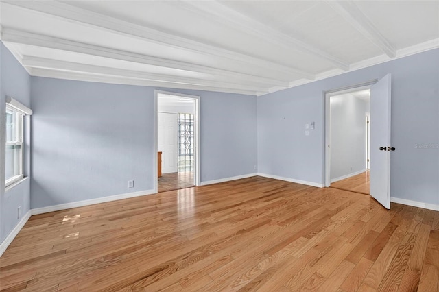 3637 Dubsdread Cir, Orlando, FL 32804 - spare room featuring light wood finished floors, baseboards, and beamed ceiling