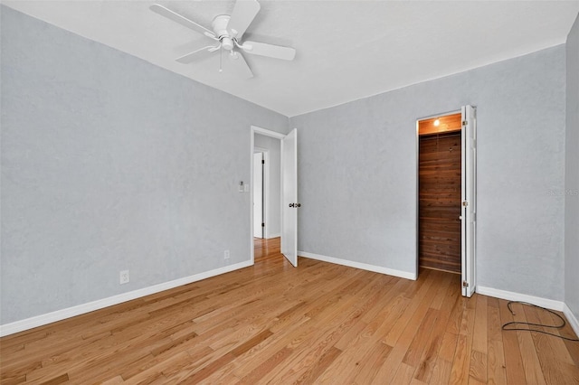 3637 Dubsdread Cir, Orlando, FL 32804 - empty room with light wood-type flooring, a ceiling fan, and baseboards