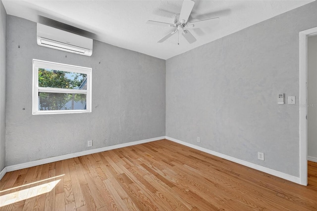 3637 Dubsdread Cir, Orlando, FL 32804 - empty room with an AC wall unit, wood finished floors, ceiling fan, and baseboards