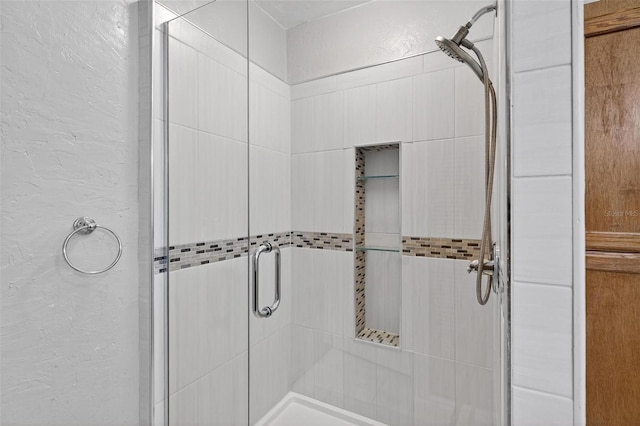 3637 Dubsdread Cir, Orlando, FL 32804 - full bathroom with a textured wall and a stall shower