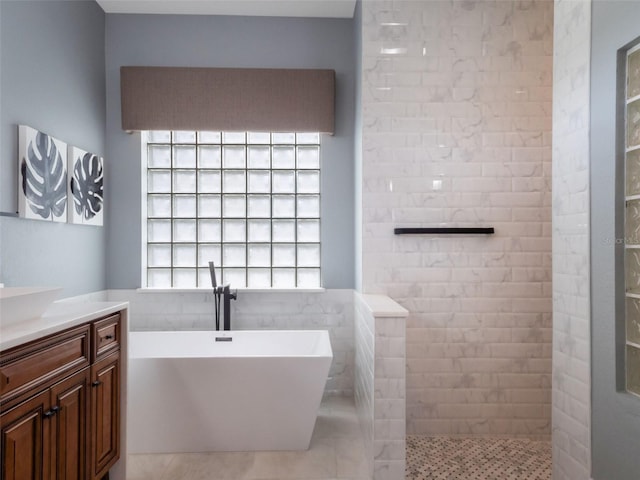 2106 Ridgewind Way, Windermere, FL 34786 - full bathroom with a freestanding bath, vanity, a walk in shower, and tile patterned flooring
