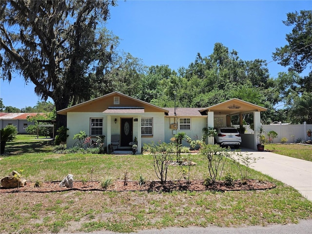 3910 Orange Ave, Coleman, FL 33521 - ranch-style house with driveway and a carport
