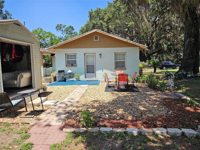 3910 Orange Ave, Coleman, FL 33521 - rear view of house featuring a patio area and concrete block siding