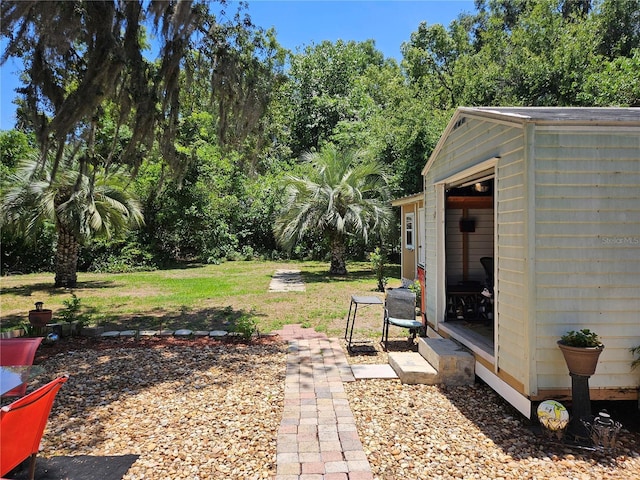 3910 Orange Ave, Coleman, FL 33521 - view of green lawn featuring an outdoor structure and view of wooded area
