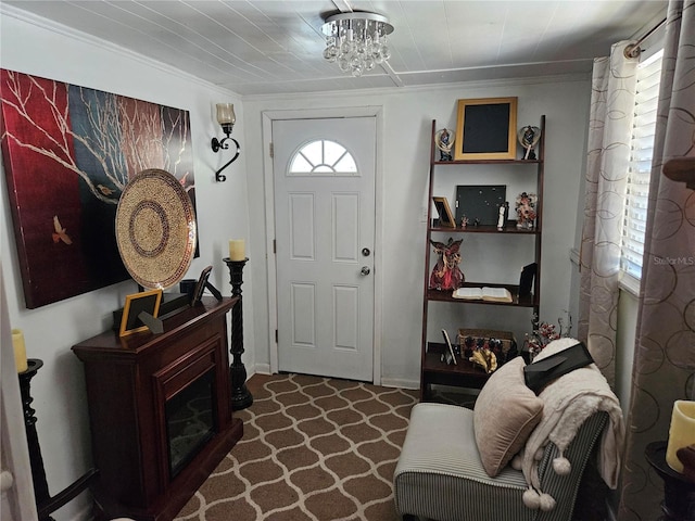 3910 Orange Ave, Coleman, FL 33521 - foyer featuring crown molding and a chandelier