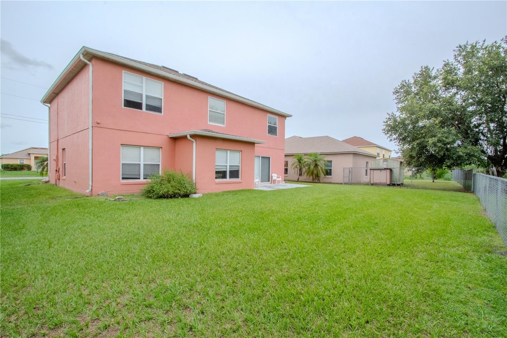 547 Brighton Ct, Kissimmee, FL 34758 - back of property with stucco siding