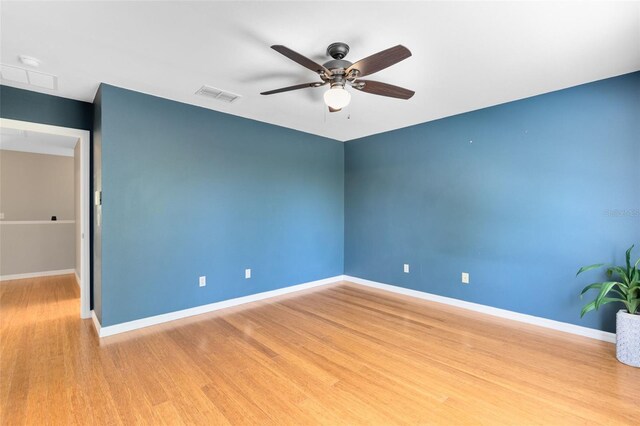 15324 Black Lion Way, Winter Garden, FL 34787 - unfurnished room featuring wood finished floors, a ceiling fan, and baseboards