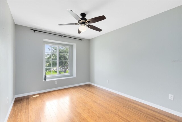 15324 Black Lion Way, Winter Garden, FL 34787 - spare room with light wood finished floors, baseboards, and a ceiling fan