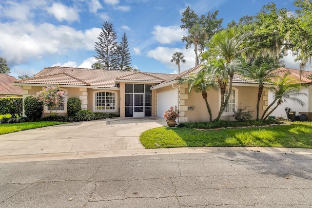 625 Nighthawk Cir, Winter Springs, FL 32708 - view of front of house with stucco siding, concrete driveway, an attached garage, and a tiled roof