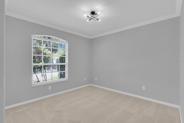 625 Nighthawk Cir, Winter Springs, FL 32708 - empty room with crown molding, light carpet, a chandelier, and baseboards