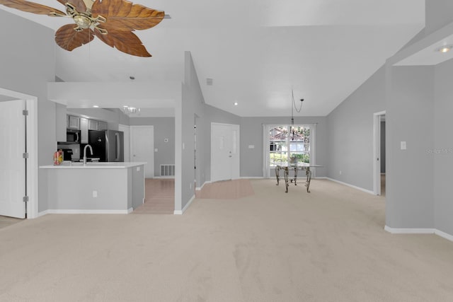 625 Nighthawk Cir, Winter Springs, FL 32708 - living room featuring a chandelier, light colored carpet, baseboards, ceiling fan, and high vaulted ceiling