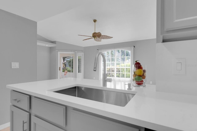 625 Nighthawk Cir, Winter Springs, FL 32708 - kitchen with a sink, vaulted ceiling, light countertops, and ceiling fan