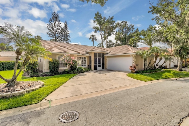 625 Nighthawk Cir, Winter Springs, FL 32708 - view of front of house with a tile roof, stucco siding, a garage, and a front lawn
