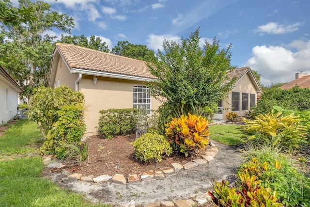 625 Nighthawk Cir, Winter Springs, FL 32708 - back of house with a tiled roof and stucco siding