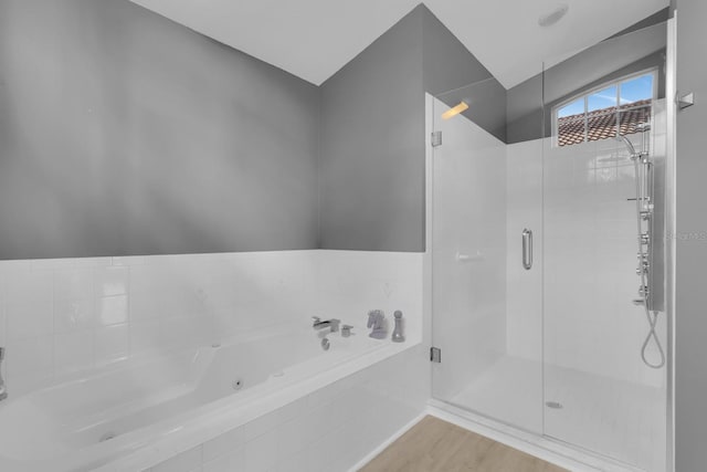 625 Nighthawk Cir, Winter Springs, FL 32708 - full bathroom featuring a whirlpool tub, a shower stall, and wood finished floors