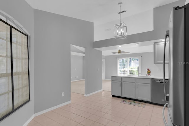 625 Nighthawk Cir, Winter Springs, FL 32708 - kitchen featuring stainless steel appliances, a sink, a chandelier, open floor plan, and a ceiling fan