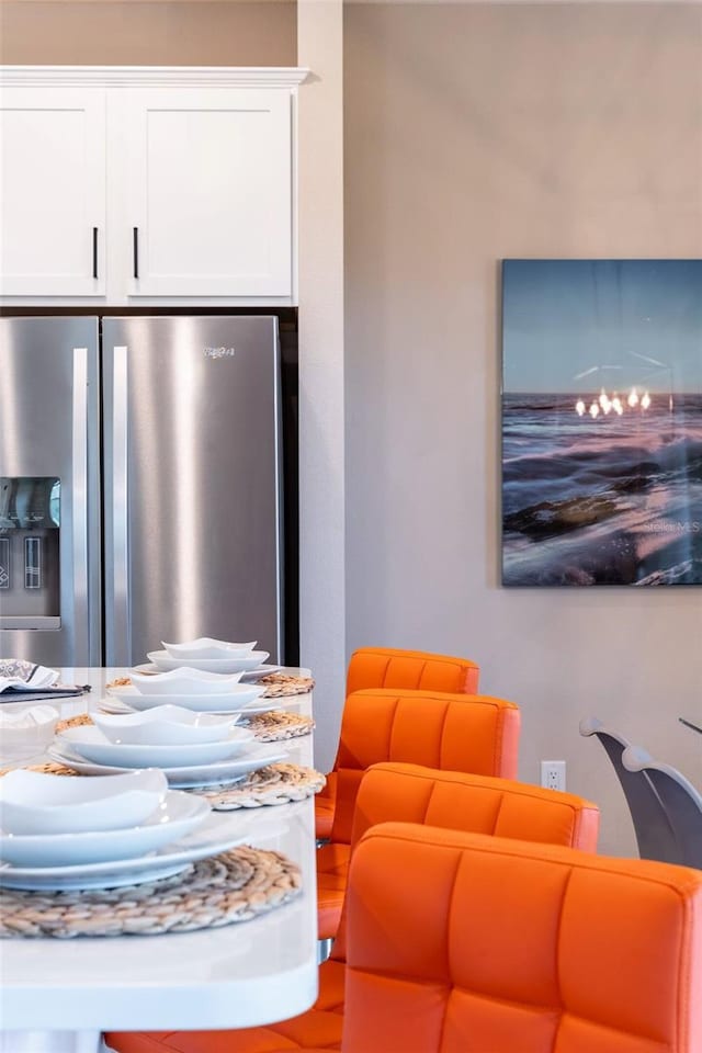 7951 Haverhill Way, Kissimmee, FL 34747 - detailed view of stainless steel refrigerator with ice dispenser and white cabinetry