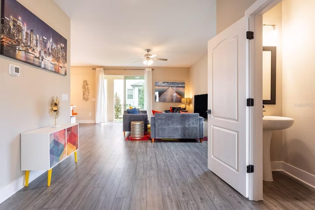 7951 Haverhill Way, Kissimmee, FL 34747 - living room with a ceiling fan, wood finished floors, and baseboards