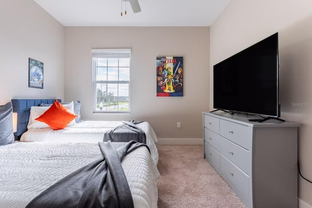 7951 Haverhill Way, Kissimmee, FL 34747 - bedroom with light colored carpet, baseboards, and ceiling fan