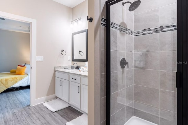 7951 Haverhill Way, Kissimmee, FL 34747 - bathroom featuring a stall shower, vanity, and wood finished floors