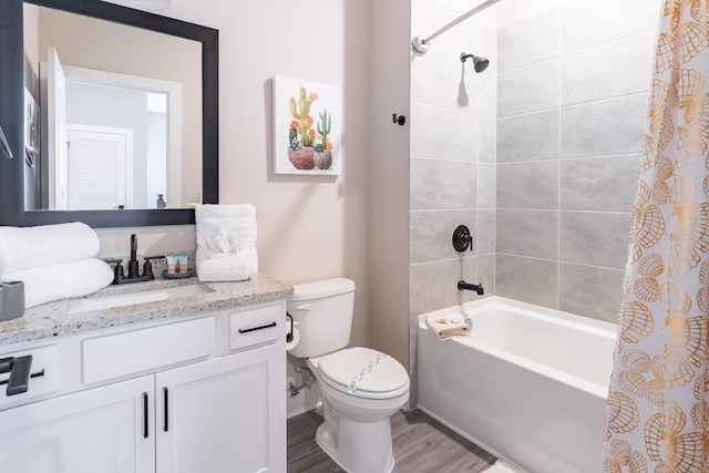 7951 Haverhill Way, Kissimmee, FL 34747 - bathroom with vanity, shower / bath combination with curtain, toilet, and wood finished floors