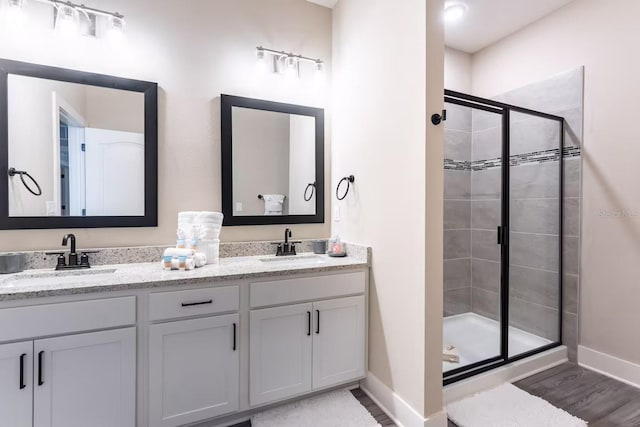 7951 Haverhill Way, Kissimmee, FL 34747 - full bath with baseboards, a stall shower, and double vanity